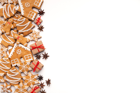 Christmas background with homemade gingerbread cookies and aromatic spices on white table, copy spaceの写真素材