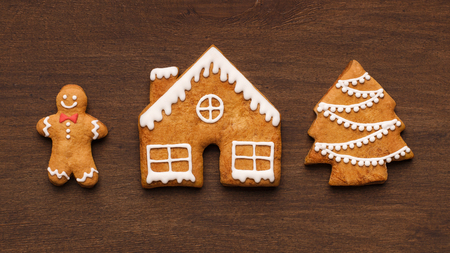 Sweet Christmas gingerbread cookies on wooden background, top view, closeupの写真素材