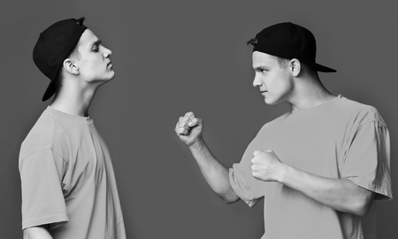 Teen guy challenging himself over studio backgroundの写真素材