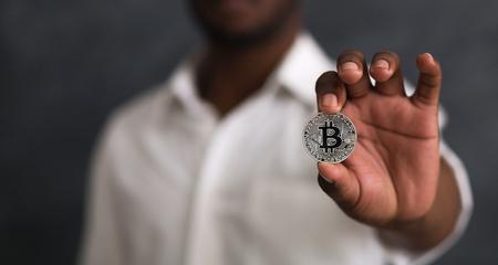 Man holding in hand crypto currency symbol. Currency of future conceptの写真素材