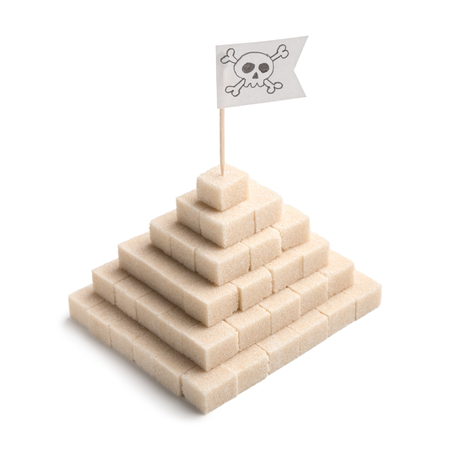 Sugar free food concept, eating sugar in harmful. White sugar pyramid with blackjack on top,...
