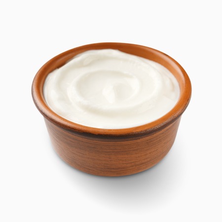 Bowl of cream on white background, top viewの写真素材