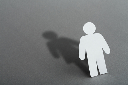 Concept of transvestite or bisexual. Transgender, man feels like woman. Shadow of male in shape of female, copy spaceの写真素材