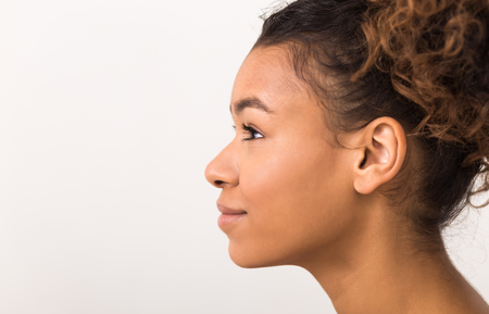 Woman profile portrait with perfect fresh clean skin without makeup, copy spaceの写真素材