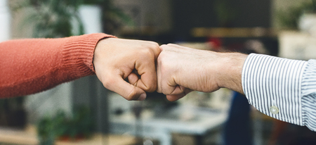 Friendship fist bump. Male friends greeting each other. Youth culture concept, panoramaの写真素材