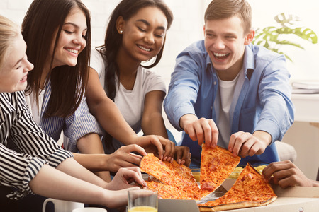 Home party. Friends eating pizza, spending time together