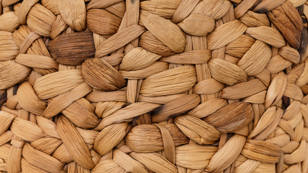 Natural woven straw basket texture background, close up