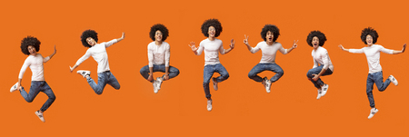 Collage of jumping bushy black guy in air on orange background, panoramaの写真素材