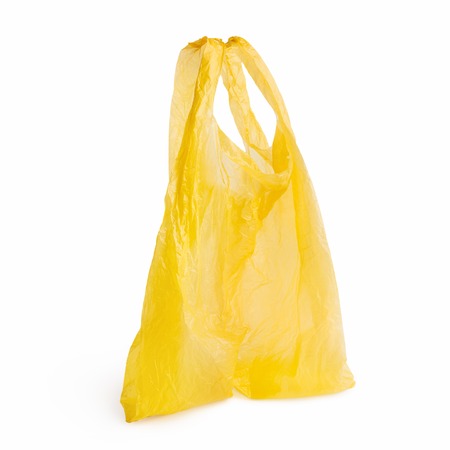 Empty yellow plastic bag isolated on white background, copy spaceの写真素材