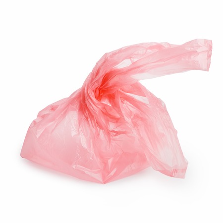 Empty pink plastic bag isolated on white backgroundの写真素材