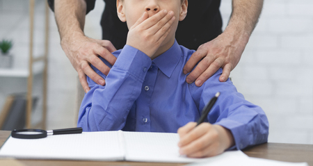 Pedophilia Concept. Boy Victim Of School Abuse. Teacher Hands On Boys Shouldersの写真素材