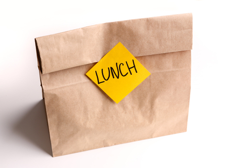 Brown paper bag with sticker on white background, Snack package from recycled materialの写真素材