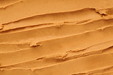 peanut butter textured background, top viewの写真素材