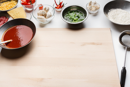 Ingredients For Cooking Pizza In Bowls On Table With Free Spaceの写真素材