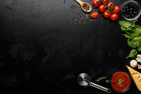 Pizza Cooking Ingredients On Black Background With Empty Space For Recipeの写真素材