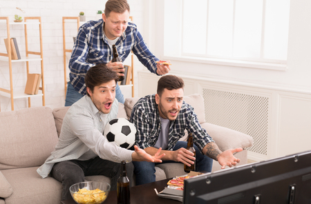 Lost Game. Angry Football Fans Watching Match And Gesturing At Homeの写真素材