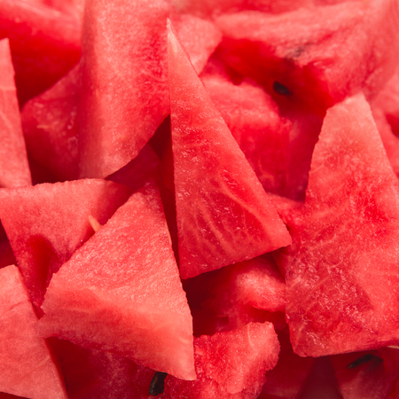 Fresh red watermelon pieces closeup, sweet summer backgroundの写真素材