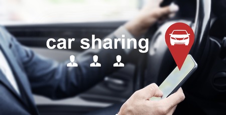 Man driving car and using mobile app of rental service, virtual car sharing and people icons, panoramaの写真素材