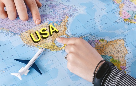 Two young people planning trip to the USA by flight, copy spaceの写真素材