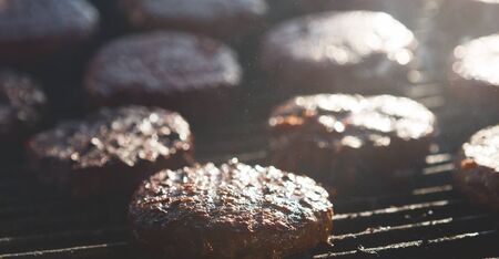 Food Festival. Cooking Delicious Juicy Meat Burgers On Grill Outdoorsの写真素材