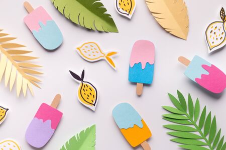 Summer wallpapers with diversed ice cream, lemons and tropical leaves on white background, panoramaの写真素材