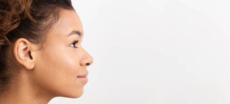 Youth and Skin Care Concept. African Girl In Profile On White Background, Free Space