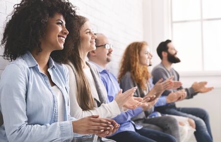 Appreciating success. Group of diverse people clapping hands at meeting, free spaceの写真素材