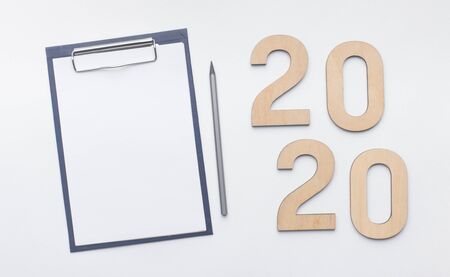 New ideas concept. 2020 wooden text with clipboard and pen on white background, panorama, copy spaceの写真素材