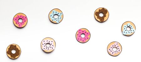 Summer background with fresh donuts on white background with candy dots, panorama, copy space