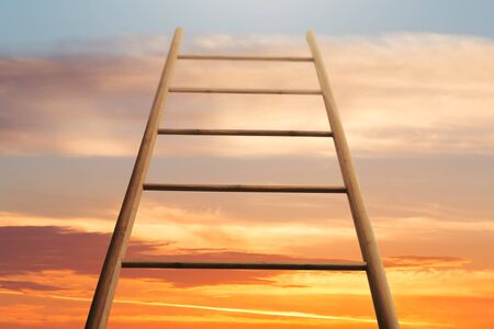 Busines Career Growth Concept. Ladder Against Sunset Skyの写真素材