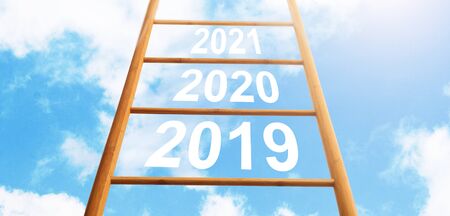 Reaching New Year 2020, Moving on Ladder Up against Blue Sky