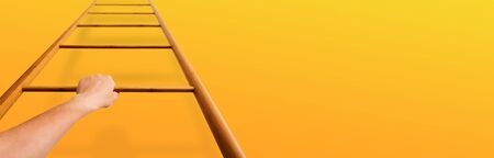 Career Growth. Woman Moving Up Ladder Over Orange Wall with Free Spaceの写真素材