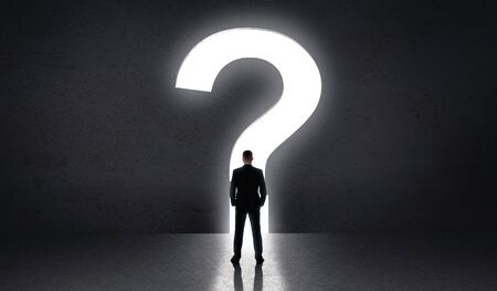 What to do further. Man standing in front of big question of life, panorama, copy spaceの写真素材