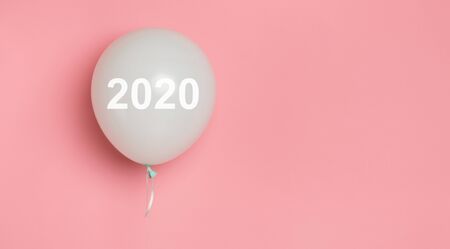 Wedding invitation 2020. Celebration balloon with white text on pink background, panorama, copy spaceの写真素材