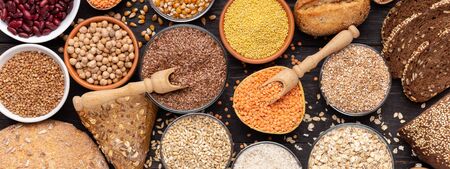 Organic products. Gluten free different grains and bread on wooden background, panoramaの写真素材