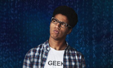 Binary system mistakes. Thoughtful Afro Guy Thinking and Looking Aside over blue Backgroundの写真素材