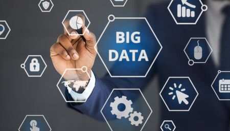 Businessman choosing one option of big data network on transparent screen, panoramaの写真素材