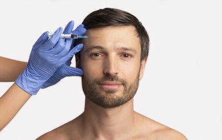 Young Man Receiving Hyaluronic Acid Injection