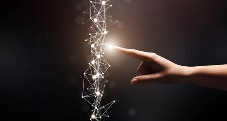 Modern technology. Woman finger Choosing point on flying network on black background, panorama, copy...