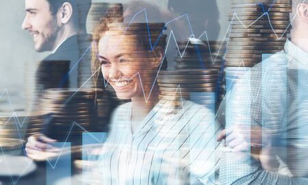 Digital economy concept. Multi exposure of business team, stack of coins and trading chartの写真素材