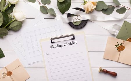 Wedding checklist for planning and other accessories on wooden table, panoramaの写真素材