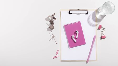 Pink style of supplies and clipboard on whiteの写真素材