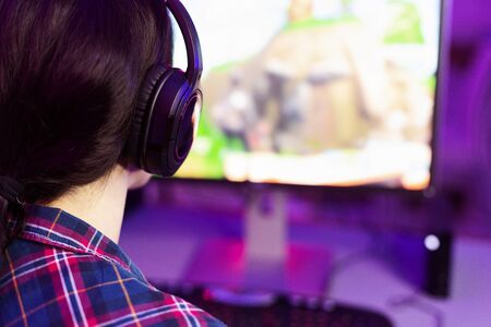 Gamer or streamer playing games on computer