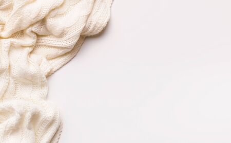 White autumn warm scarf on white background with copy spaceの写真素材