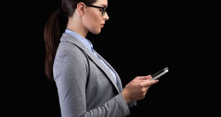 ID Recognition. Businesswoman Using Mobile Phone Scanning Face Identifying Person On Black Background In Studio. Panorama, Side Viewの写真素材