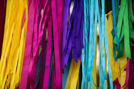 Hippy concept. Bright and different colored paper stripes background, summer party