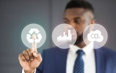 Businessman choosing renewable energy for sustainable development of company, modern technologies...