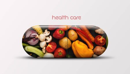 Creative and healthy vitamin pill with fruits and vegetables inside, panorama, white backgroundの写真素材