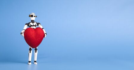 Cute robot holding red heart, blue panorama background with empty spaceの写真素材
