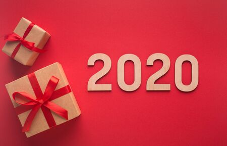 New 2020 year concept with presents on red background with textの写真素材